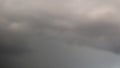 Abstract long-exposure photograph of an overcast sky featuring blurred layers of dark gray and subtle soft pink Royalty Free Stock Photo
