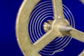 Abstract: Looking Through a Vintage Metallic Balance Wheel to Its Hairspring