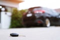 Abstract lost car keys fall lying on the street concrete cement ground roadway home front yard. transportation concept.