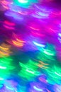 Abstract luminous seamless background of blurred multicolored neon lights.