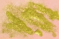 Abstract luxurious liquid golden lights glitter on pastel pink background
