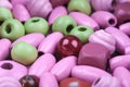 Abstract macro background of pink and green toy beads Royalty Free Stock Photo