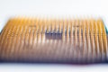 Abstract macro photo of a gold and black computer CPU