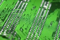 Abstract macro view of green printed circuit board