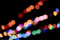 Abstract magic background with bokeh effect. Three multicolored garlands, defocused bokeh lights on an isolated black Royalty Free Stock Photo