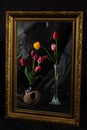 Abstract Magic. Tulip flowers in dark room reflecting in mirror