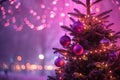 Abstract magical Christmas tree with pink and violet bokeh background Royalty Free Stock Photo