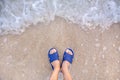 Abstract Man foot with shoe walk on soft sand at the beach with waves. Illustration in a comfortable vacation by the sea Royalty Free Stock Photo