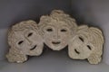 Abstract masks. Antique ancient stone sculpture with selective focus. Background with copy space Royalty Free Stock Photo