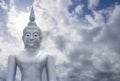 Abstract merge layer sky on image of Buddha with blue sky and cloud in background, light effect added , prachuapkhirikhan