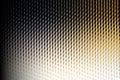 Abstract metallic grid pattern with a gradient of light and shadow, creating a sense of depth Royalty Free Stock Photo