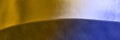 Abstract metallic surface with curved yellow and blue lighting effect Royalty Free Stock Photo