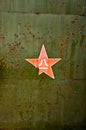 Abstract military green background with red star.