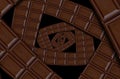 Abstract milk chocolate square spiral made of chocolate bar. Twirl abstract. Chocolate background pattern.Dark chocolate spiral Royalty Free Stock Photo