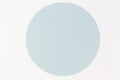 Abstract minimal color paper background. Pastel blue round circle on white background. Top view, flat lay Royalty Free Stock Photo