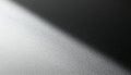 Abstract minimalist background with a diagonal beam of light on a textured surface creating a stark shadow Royalty Free Stock Photo