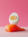 Abstract minimalist image of a boiled egg on top of a piece of raw salmon. Pink background with copy space. Generative AI Royalty Free Stock Photo