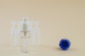 Abstract model of coronavirus, ampoule and bottle with gel for hands