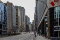 Montreal modern architecture - urban style, high-rise buildings, glass and concrete, street, empty road, cloudy day Royalty Free Stock Photo