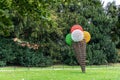 Abstract modern art, ice cream cone sculpture in a park. Royalty Free Stock Photo