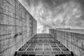 Abstract modern building and a grey cloudy sky Royalty Free Stock Photo