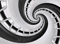 Abstract modern car wheel rim with tire twisted into surreal spiral. Automobile repetitive pattern background illustration. Car ab Royalty Free Stock Photo