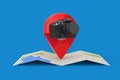 Abstract Modern Digital Photo Camera over Folded Abstract Navigation Map with Target Pin Pointer. 3d Rendering Royalty Free Stock Photo