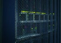 Abstract of modern high tech internet data center room with rows racks network and server hardware. Royalty Free Stock Photo