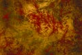 Abstract modern painting .Red paint splashes on gold background. Grunge texture Royalty Free Stock Photo