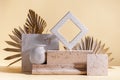 Abstract modern still life. Natural materials. Composition of palm leaves, travertine and concrete blocks