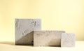 Abstract modern still life. Natural materials. Composition of travertine and concrete blocks