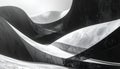 Abstract Monochrome Composition of Intersecting Curved Forms with Textured Surfaces and Contrasting Light Royalty Free Stock Photo