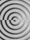 Monochrome spiral pattern with textured concentric circles effect Royalty Free Stock Photo