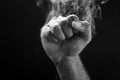 Image of a fist and smoke Royalty Free Stock Photo