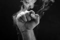 Image of a fist and smoke Royalty Free Stock Photo