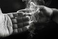 Image of hands and smoke Royalty Free Stock Photo