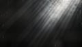 Abstract monochrome image with vintage film texture. Light rays, subtle glow create grunge atmosphere. Grainy background with