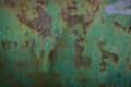 Abstract, moody wall texture background. Green and brown surface. Creative backdrop design. Rusty metal wall fragment. Old iron Royalty Free Stock Photo