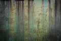 Abstract, moody wall texture background. Green and brown surface. Creative backdrop design. Rusty metal wall fragment Royalty Free Stock Photo