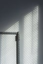 Abstract of morning light and shadow on wall through window blind shutter. Light through blinds window. Parallel lines of light Royalty Free Stock Photo