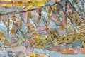 Abstract mosaic of pieces of ceramic tiles and natural stones. Mosaic background and texture