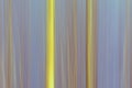 Abstract motion blur background in soft yellow and blue with vertical lines