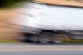 Abstract motion blur speeding tractor trailer big rig on country road Royalty Free Stock Photo