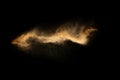 Abstract motion blurred brown sand background.Sandy explosion isolated on over dark background Royalty Free Stock Photo