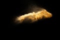 Abstract motion blurred brown sand background.Sandy explosion isolated on over dark background Royalty Free Stock Photo