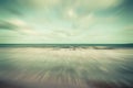 Abstract motion blurred sea and blue sky clouds vintage Royalty Free Stock Photo