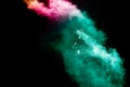 Abstract multi color powder explosion on black background Royalty Free Stock Photo