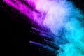 Abstract multi color powder explosion on black background. Royalty Free Stock Photo