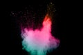 Abstract multi color powder explosion on black background. Royalty Free Stock Photo