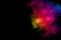 Abstract multi color powder explosion on black background Royalty Free Stock Photo